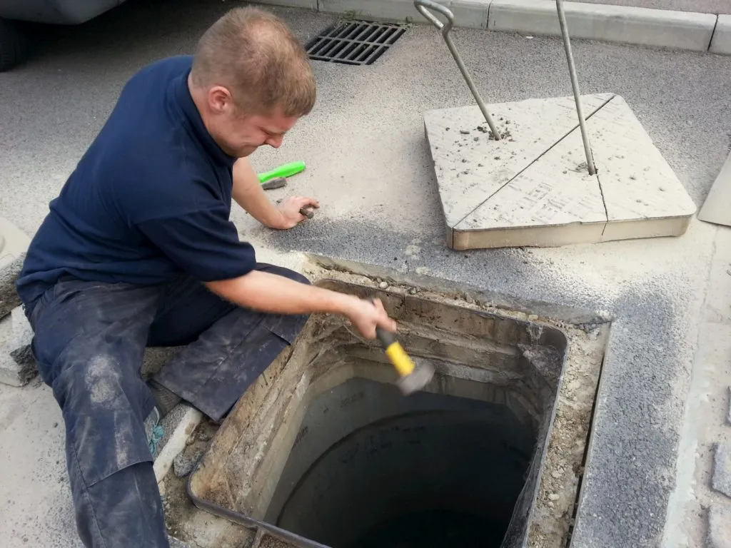 Engineer repairing a manhole chamber
